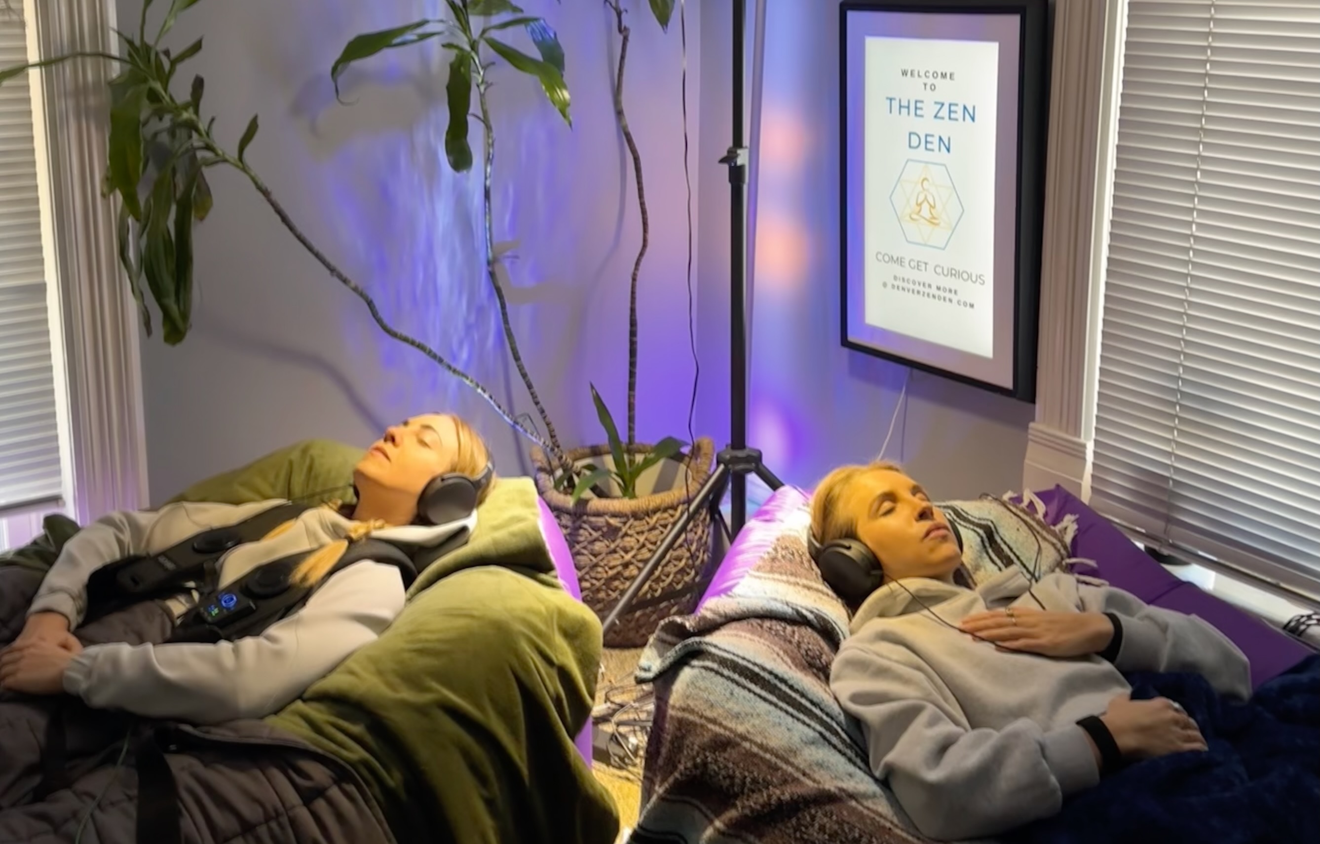 Two guests resting side by side during a shared Denver Zen Den session
